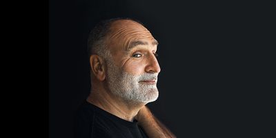Chef José Andrés against a black background